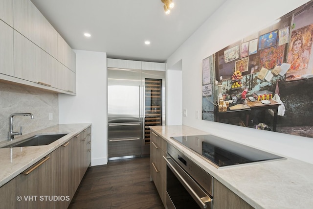 1300 N Lake Shore Dr Unit 21D, Chicago, IL 60610 - kitchen featuring stainless steel oven, fridge, modern cabinets, black electric cooktop, and dark wood-style floors