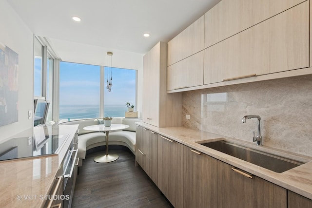 1300 N Lake Shore Dr Unit 21D, Chicago, IL 60610 - kitchen featuring modern cabinets, dark wood-style flooring, light stone counters, tasteful backsplash, and recessed lighting