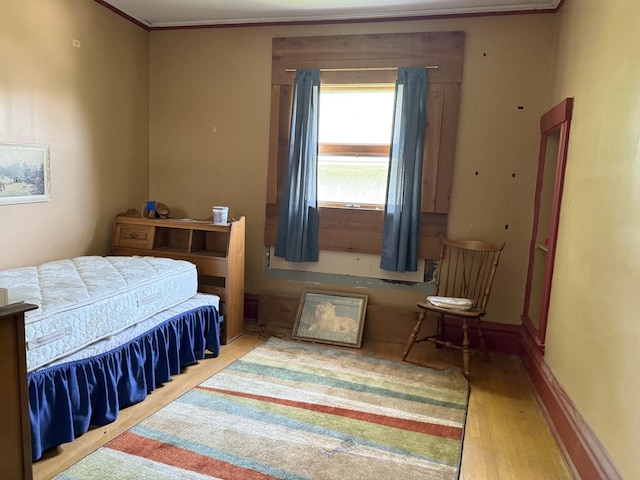7005 34th St, Berwyn, IL 60402 - bedroom featuring wood finished floors and ornamental molding