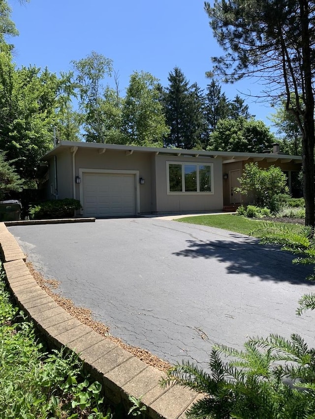 743 Dundee Ave, Barrington, IL 60010 - view of front of house with a garage, driveway, and stucco siding