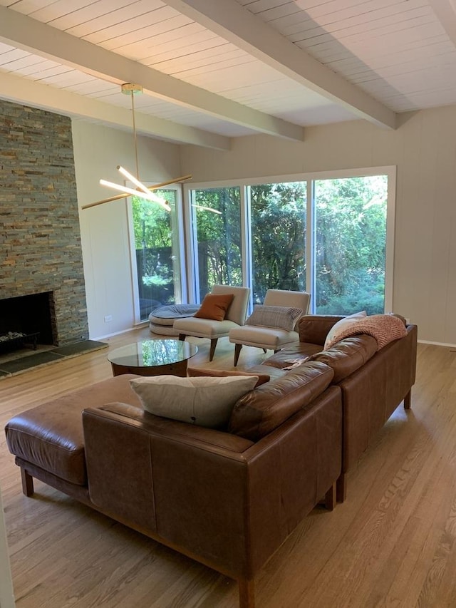 743 Dundee Ave, Barrington, IL 60010 - living room with wood finished floors, healthy amount of natural light, a fireplace, and a wooden ceiling with exposed beams