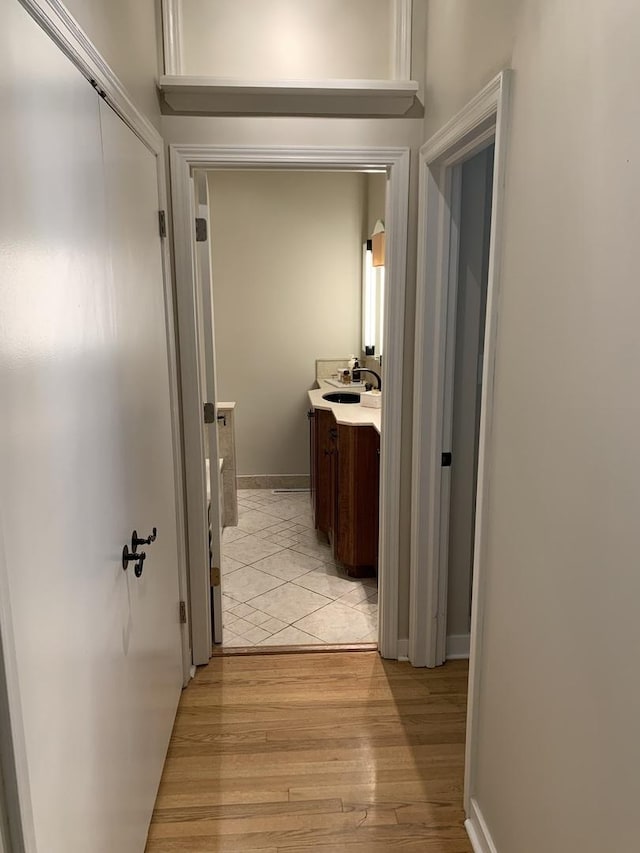 743 Dundee Ave, Barrington, IL 60010 - corridor featuring light wood-style flooring and a sink