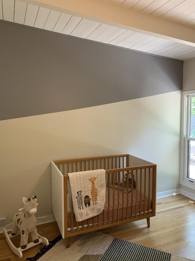 743 Dundee Ave, Barrington, IL 60010 - bedroom with wood finished floors, a nursery area, and wood ceiling