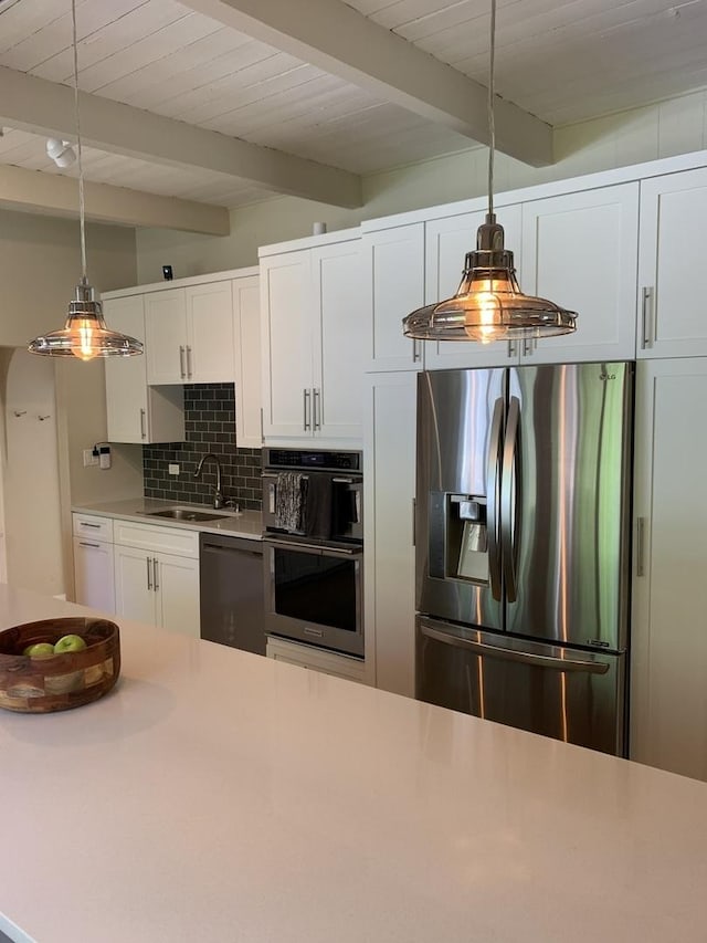743 Dundee Ave, Barrington, IL 60010 - kitchen with appliances with stainless steel finishes, light countertops, decorative backsplash, decorative light fixtures, and white cabinets