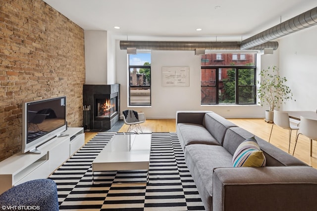 1525 N Milwaukee Ave Unit 3, Chicago, IL 60622 - living room featuring wood finished floors, a warm lit fireplace, and recessed lighting