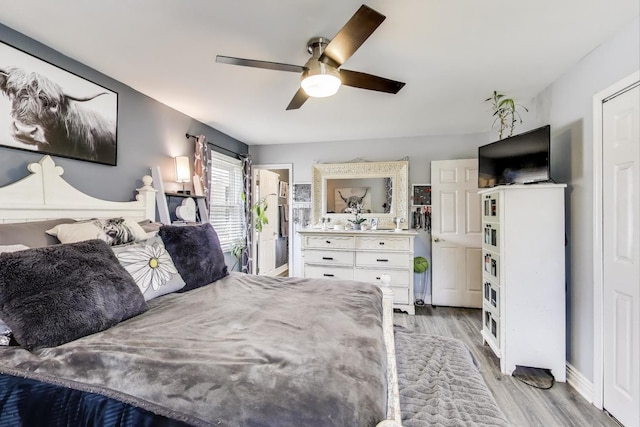 810 Woodhollow Ln, Buffalo Grove, IL 60089 - bedroom with light wood-style flooring and a ceiling fan