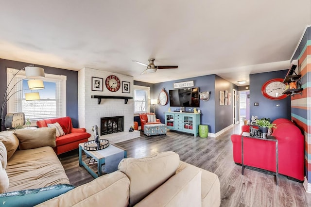 810 Woodhollow Ln, Buffalo Grove, IL 60089 - living room with wood finished floors, ceiling fan, and a fireplace