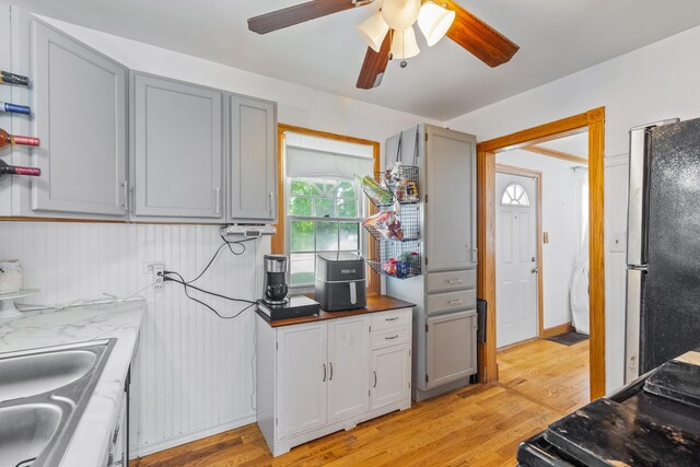 2808 Elder Ln, Franklin Park, IL 60131 - kitchen with freestanding refrigerator, gray cabinetry, and light wood-style flooring
