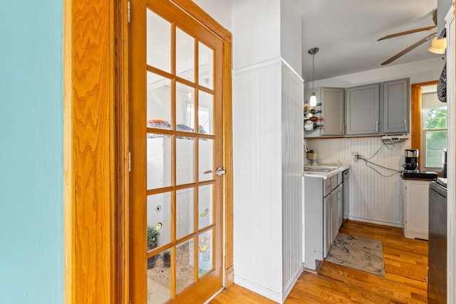 2808 Elder Ln, Franklin Park, IL 60131 - kitchen with gray cabinets, a ceiling fan, light wood-type flooring, and pendant lighting