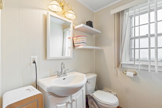 2808 Elder Ln, Franklin Park, IL 60131 - bathroom featuring ornamental molding, vanity, and a decorative wall