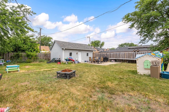 2808 Elder Ln, Franklin Park, IL 60131 - fenced backyard with an outdoor fire pit, an outbuilding, and a patio area