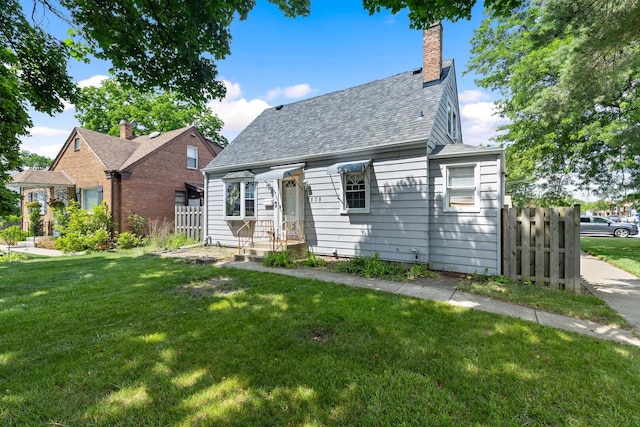 2808 Elder Ln, Franklin Park, IL 60131 - new england style home featuring roof with shingles and a chimney