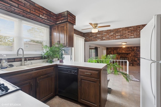 kitchen featuring freestanding refrigerator, dishwasher, a ceiling fan, light countertops, and dark brown cabinets