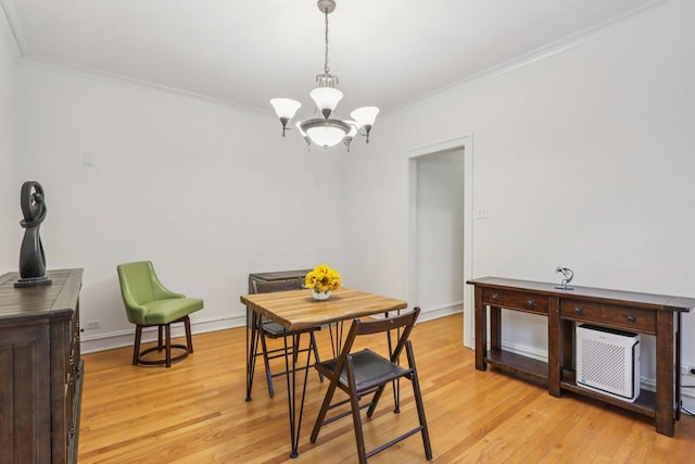 820 Washington Blvd Unit 3, Oak Park, IL 60302 - dining area featuring a chandelier, light wood-type flooring, ornamental molding, and an AC wall unit