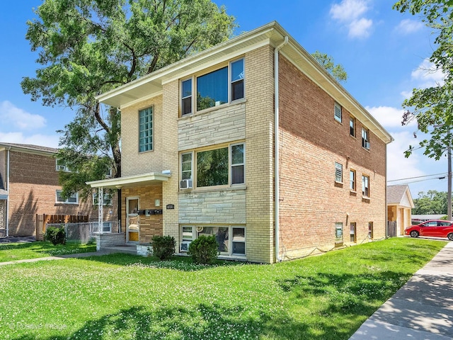 6737 W Lloyd Dr, Worth, IL 60482 - view of front of home with brick siding and a front yard