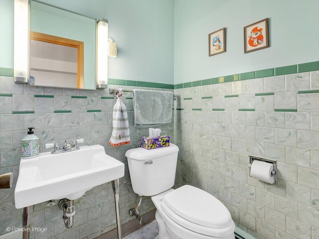6737 W Lloyd Dr, Worth, IL 60482 - half bathroom featuring tile walls and wainscoting