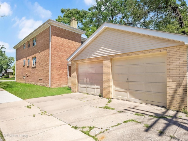 6737 W Lloyd Dr, Worth, IL 60482 - view of front facade featuring brick siding, a chimney, an outdoor structure, and a detached garage