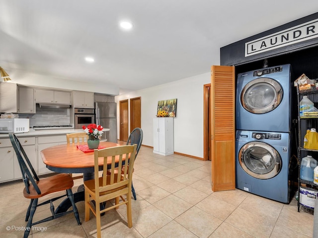 6737 W Lloyd Dr, Worth, IL 60482 - dining area featuring estacked washer and dryer, light tile patterned flooring, and recessed lighting
