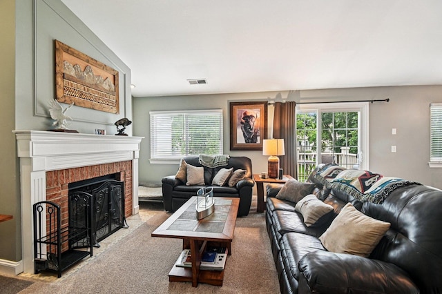 1604 Brittany Ct Unit 2B, Wheeling, IL 60090 - carpeted living room with healthy amount of natural light and a brick fireplace