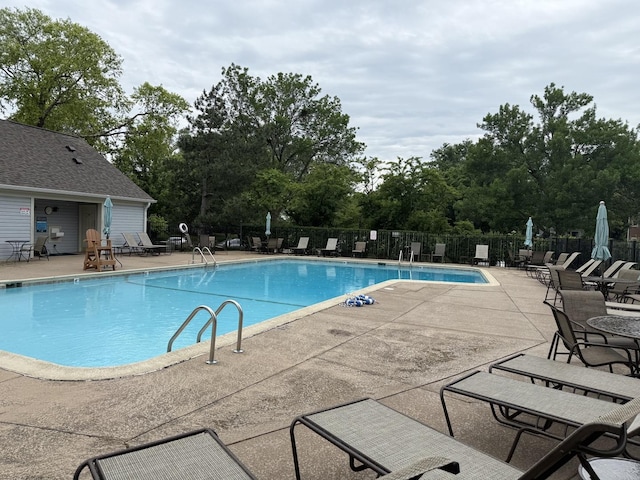 1604 Brittany Ct Unit 2B, Wheeling, IL 60090 - community pool featuring a patio area and view of wooded area