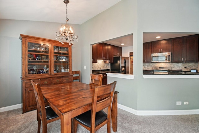 1604 Brittany Ct Unit 2B, Wheeling, IL 60090 - dining area with light colored carpet, a chandelier, and recessed lighting