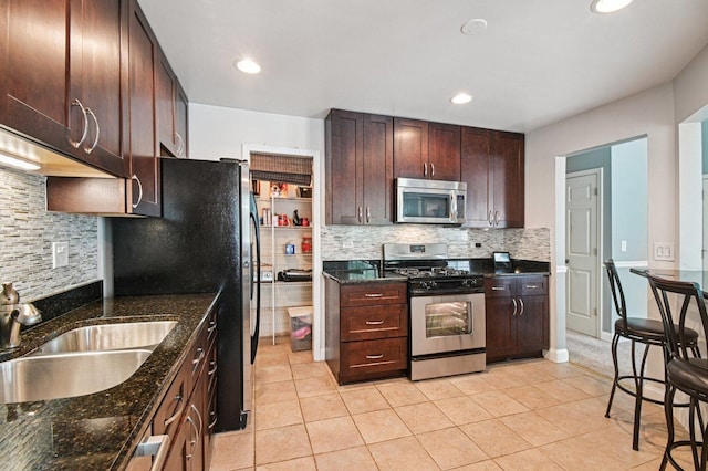 1604 Brittany Ct Unit 2B, Wheeling, IL 60090 - kitchen with stainless steel appliances, tasteful backsplash, dark stone counters, light tile patterned floors, and recessed lighting