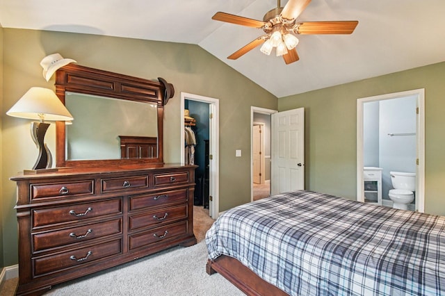 1604 Brittany Ct Unit 2B, Wheeling, IL 60090 - bedroom with light carpet, a spacious closet, vaulted ceiling, a closet, and ensuite bathroom