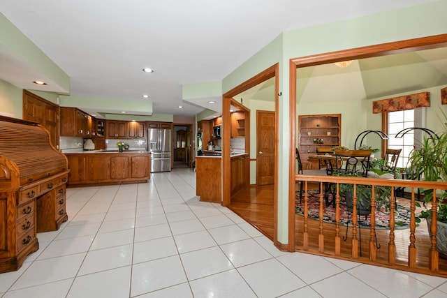 24029 S Plum Valley Dr, Crete, IL 60417 - kitchen featuring appliances with stainless steel finishes, brown cabinetry, recessed lighting, decorative backsplash, and light tile patterned floors