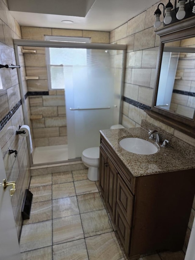 17936 66th Ave, Tinley Park, IL 60477 - bathroom with vanity, a shower stall, backsplash, and tile walls