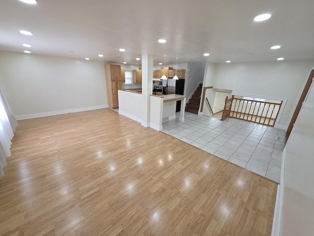 17936 66th Ave, Tinley Park, IL 60477 - unfurnished living room featuring light wood-type flooring and recessed lighting