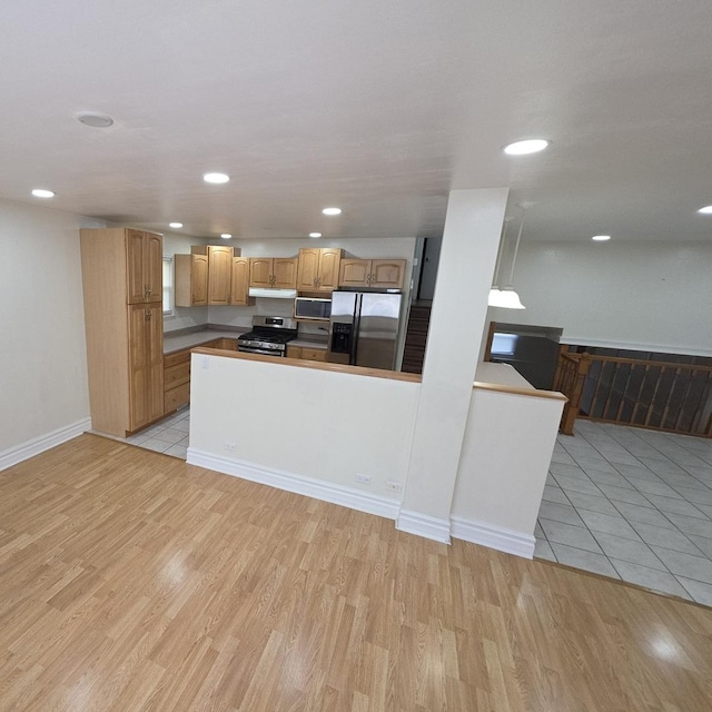 17936 66th Ave, Tinley Park, IL 60477 - kitchen with stainless steel appliances, light wood finished floors, a peninsula, recessed lighting, and under cabinet range hood
