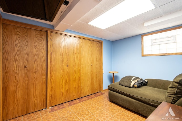 7707 Moody Ave, Burbank, IL 60459 - living area with a paneled ceiling