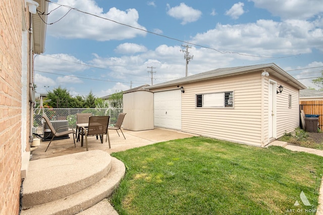7707 Moody Ave, Burbank, IL 60459 - view of yard featuring an outdoor structure, a detached garage, outdoor dining space, and a patio area