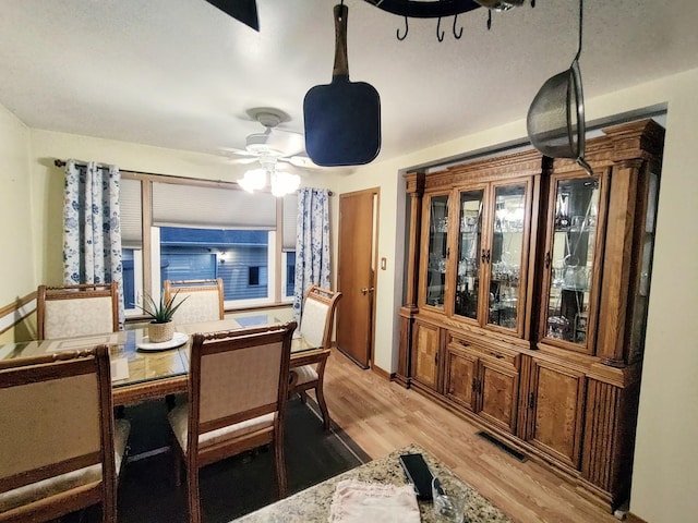 7707 Moody Ave, Burbank, IL 60459 - dining area featuring light wood-style floors and a ceiling fan