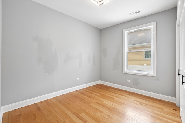 1715 N 15th Ave, Melrose Park, IL 60160 - empty room with baseboards and light wood finished floors