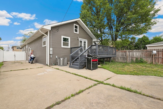1715 N 15th Ave, Melrose Park, IL 60160 - rear view of house with a wooden deck, a gate, and a fenced backyard