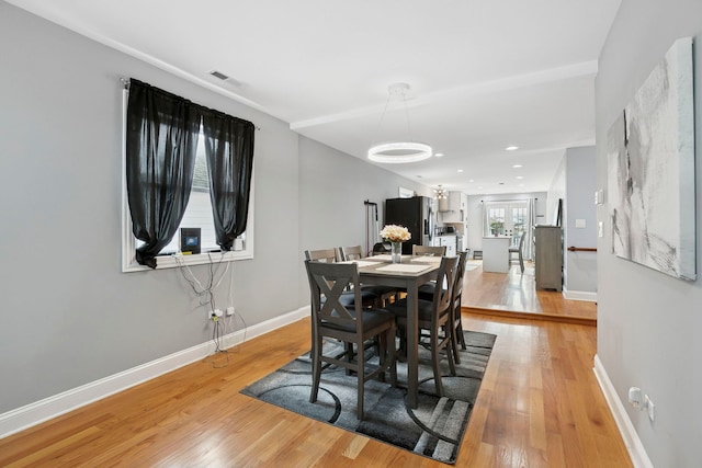 1715 N 15th Ave, Melrose Park, IL 60160 - dining room featuring light wood finished floors, a chandelier, and recessed lighting