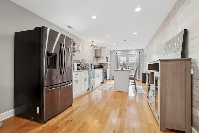 1715 N 15th Ave, Melrose Park, IL 60160 - kitchen with stainless steel appliances, light wood finished floors, white cabinetry, light countertops, and recessed lighting