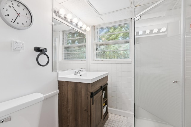 bathroom with vanity and a shower
