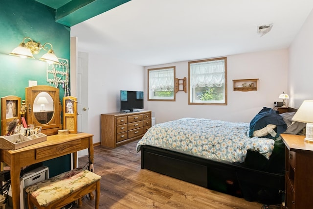 bedroom with wood finished floors