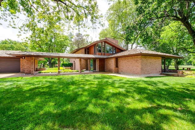 1200 Regency Ln, Lake Forest, IL 60045 - view of front facade featuring an attached garage, a front yard, and brick siding