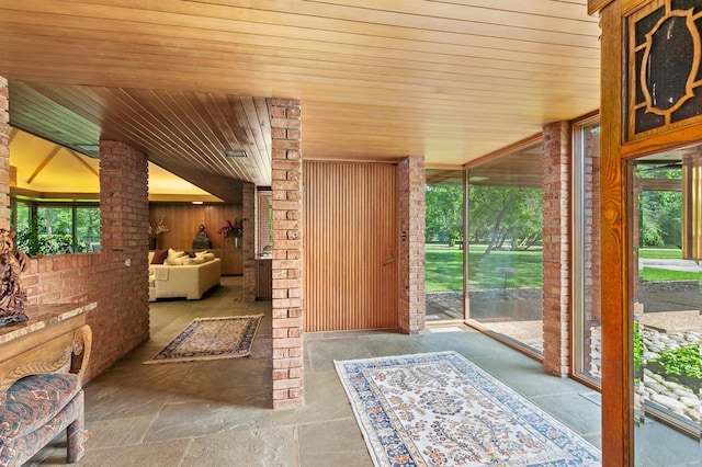 1200 Regency Ln, Lake Forest, IL 60045 - entryway featuring plenty of natural light, wood ceiling, and brick wall