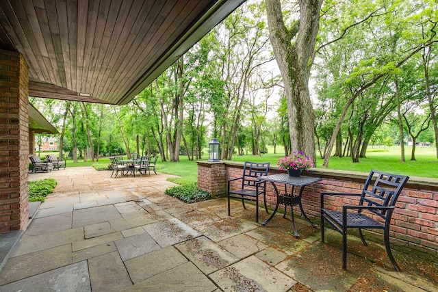 1200 Regency Ln, Lake Forest, IL 60045 - view of patio featuring outdoor dining space and view of scattered trees