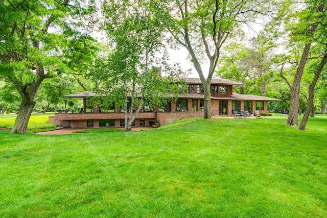 1200 Regency Ln, Lake Forest, IL 60045 - back of property featuring a yard and brick siding