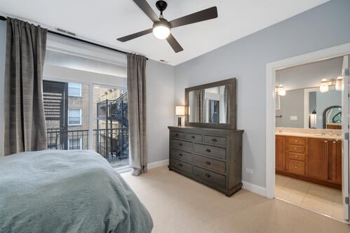 4259 N Ashland Ave Unit 2, Chicago, IL 60613 - bedroom with access to outside, connected bathroom, ceiling fan, and light carpet