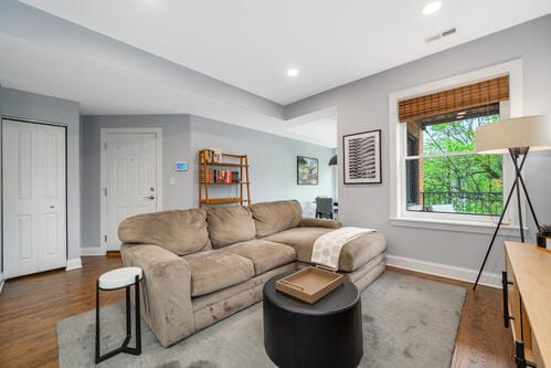 4259 N Ashland Ave Unit 2, Chicago, IL 60613 - living room featuring wood finished floors and recessed lighting