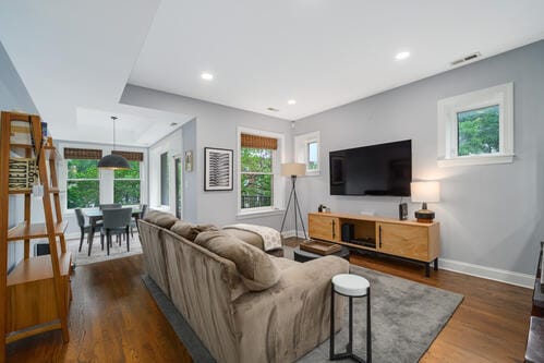 4259 N Ashland Ave Unit 2, Chicago, IL 60613 - living room with plenty of natural light, wood finished floors, and recessed lighting