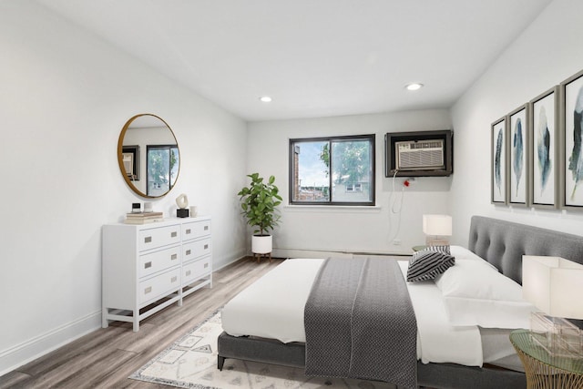 5525 N Chester Ave Unit 46, Chicago, IL 60656 - bedroom featuring a wall mounted AC, wood finished floors, and recessed lighting