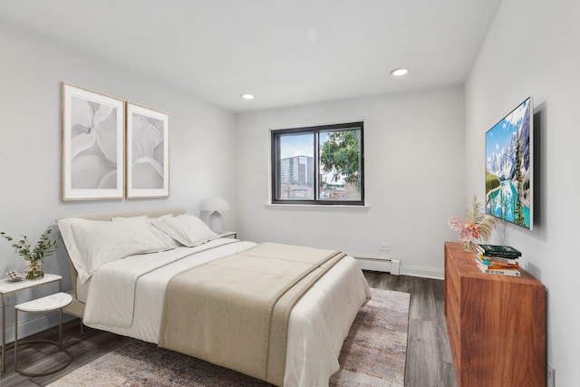 5525 N Chester Ave Unit 46, Chicago, IL 60656 - bedroom with dark wood-type flooring, a baseboard heating unit, and recessed lighting