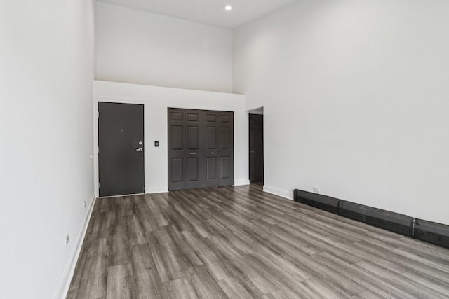 5525 N Chester Ave Unit 46, Chicago, IL 60656 - empty room featuring wood finished floors, a high ceiling, and recessed lighting